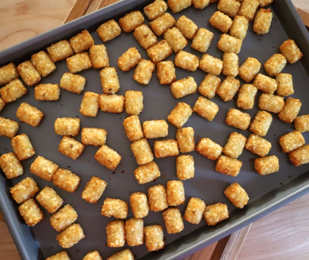 Arrange tater tots in a single layer on a sheet pan
