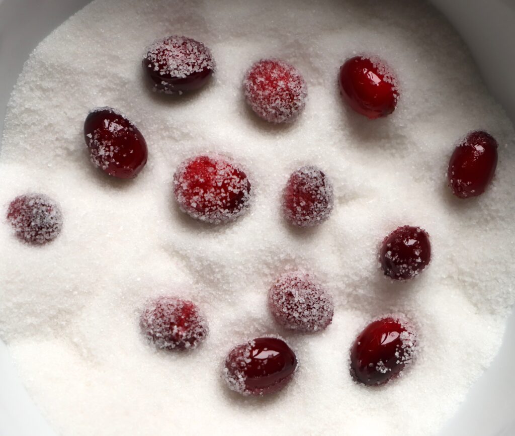 Roll cranberries in batches in the remaining sugar to coat.