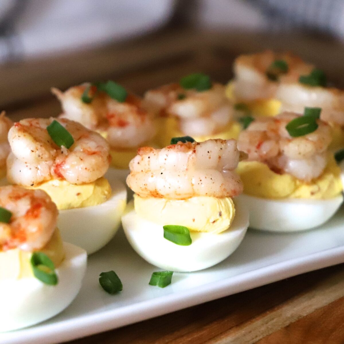 Cajun Deviled Eggs with Shrimp on a plate.