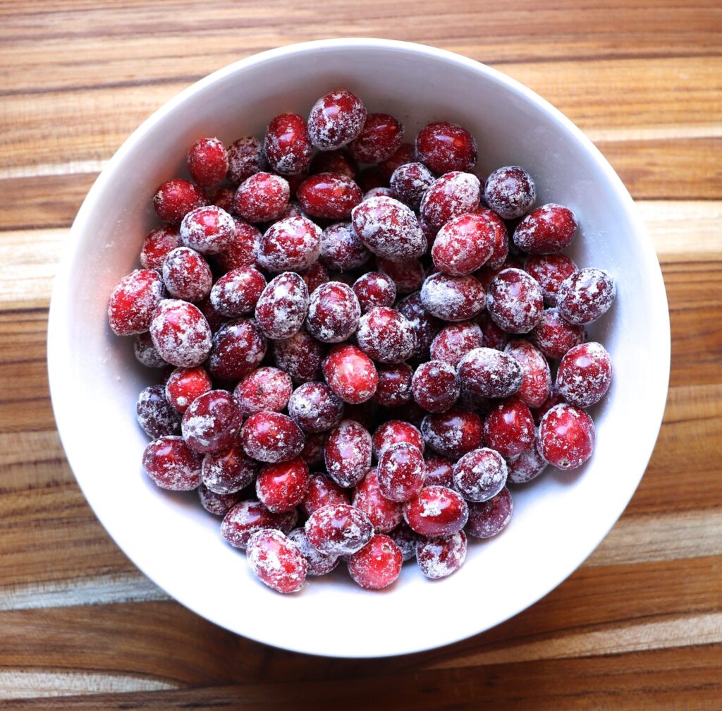 Toss the cranberries with 1 teaspoon of flour.