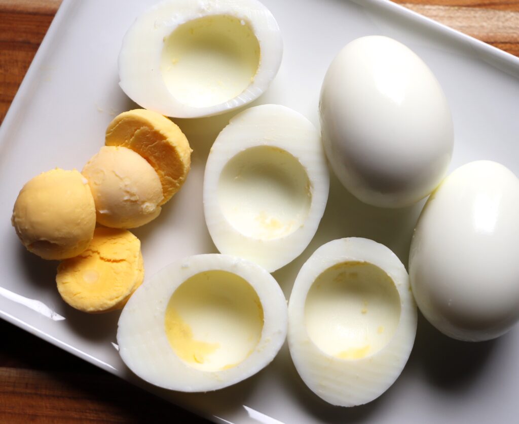 Slice eggs in half lengthwise and remove yolks.